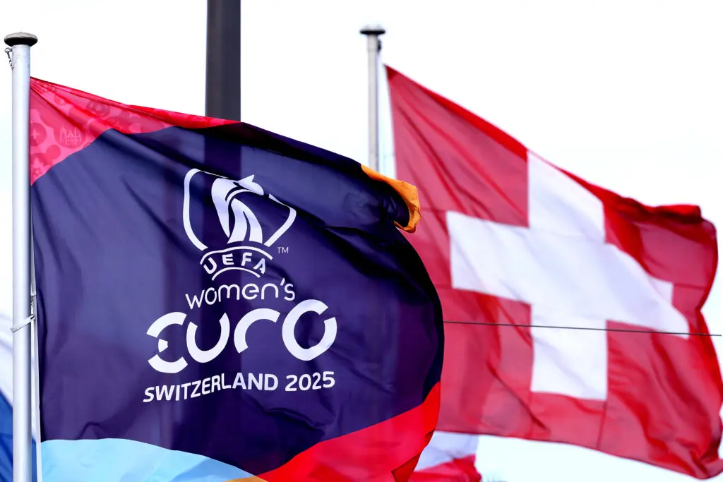 A general view of a official UEFA Women's Euro 2025 flag next to a Swiss national flagat the city of Zurich ahead of the UEFA Women's Euro 2025 on July 01, 2025 in Zurich, Switzerland.