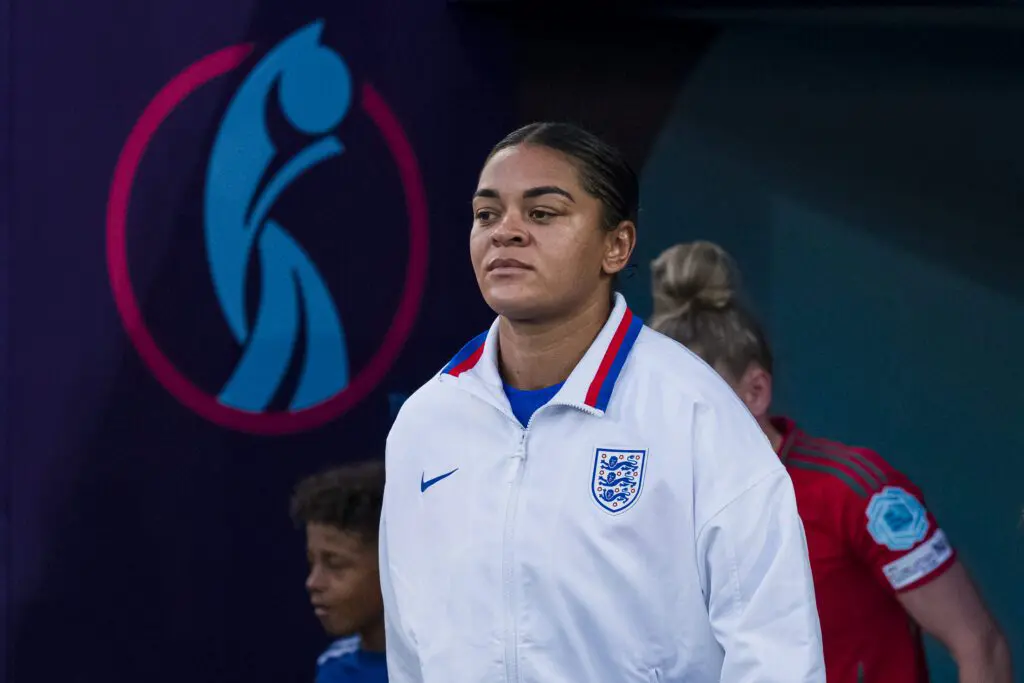 England defender Jess Carter enters the pitch for a 2025 Euro match.