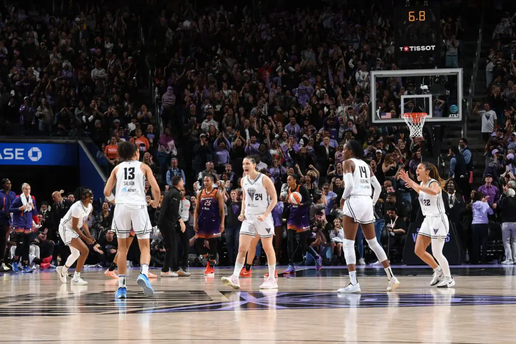 Forward Janelle Salaün celebrates her game-tying basket with her Golden State Valkyries teammates during a 2025 WNBA game.