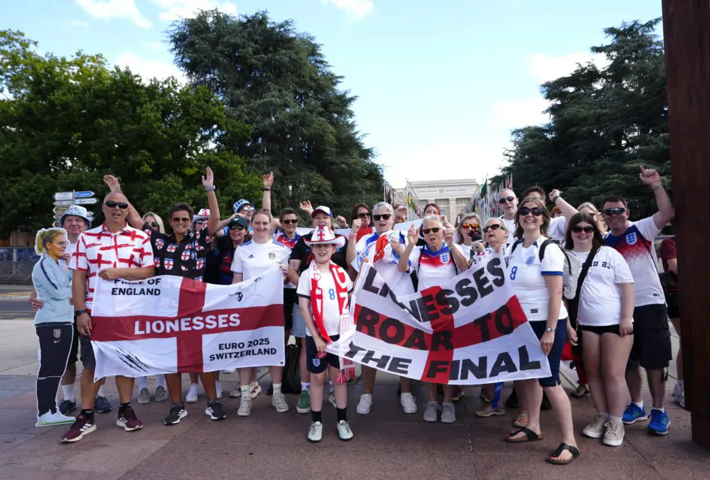 England fans pose for a photo while celebrating the Lionesses' upcoming 2025 Euro semifinal berth.