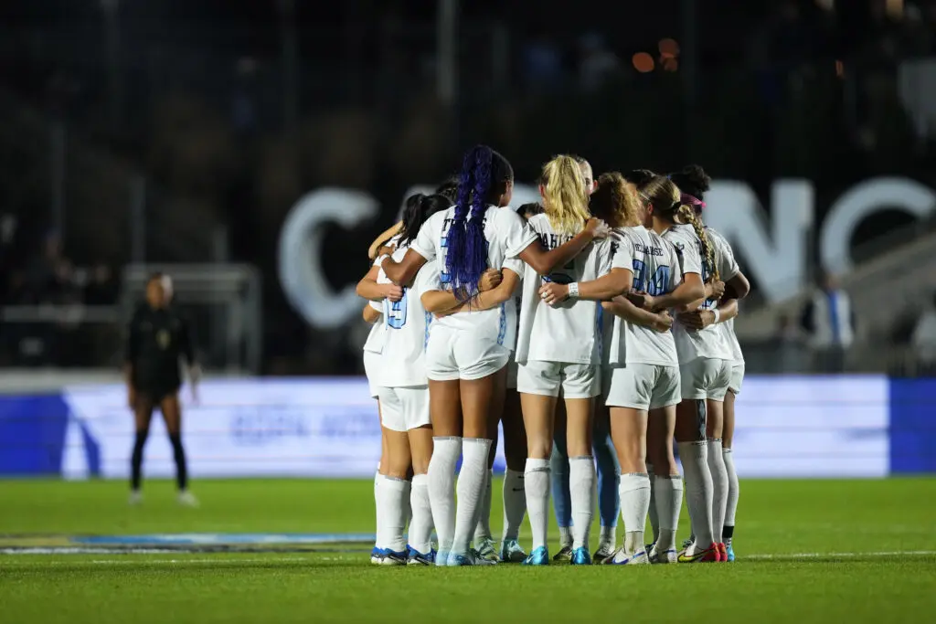The UNC Tar Heels huddle during the 2024 NCAA championship match.