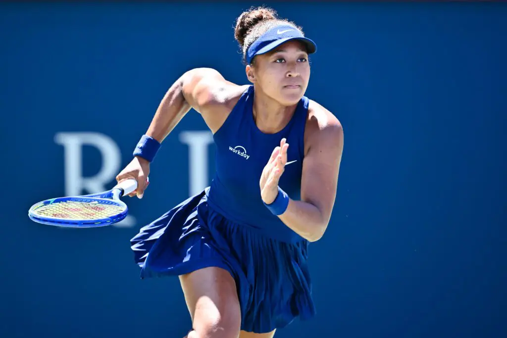 Japan tennis star Naomi Osaka races across the court during a 2025 Canadian Open match.