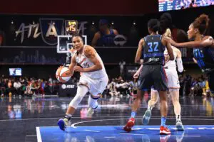 Phoenix Mercury forward Alyssa Thomas dribbles down the lane during a 2025 WNBA game.