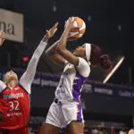 LA Sparks forward Rickea Jackson shoots the ball over Washington Mystics forward Alysha Clark during a 2025 WNBA game.