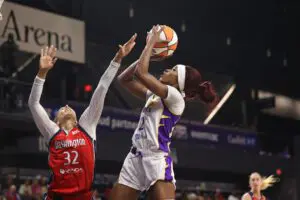 LA Sparks forward Rickea Jackson shoots the ball over Washington Mystics forward Alysha Clark during a 2025 WNBA game.