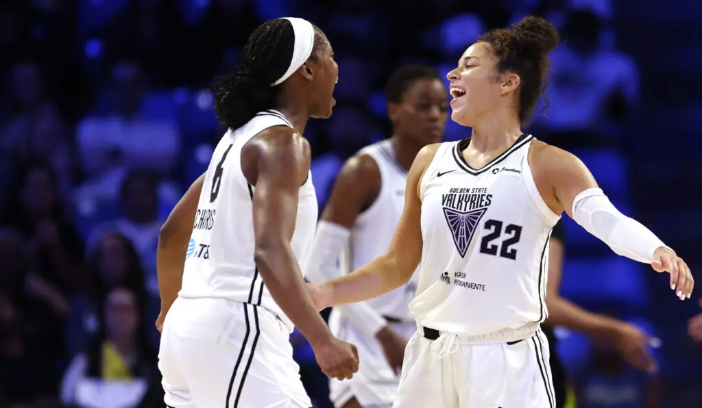 Golden State Valkyries guards Kaila Charles and Veronica Burton celebrate a 2025 WNBA road win over the Dallas Wings.