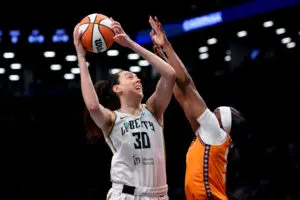 New York Liberty forward Breanna Stewart shoots over Connecticut Sun forward Aneesah Morrow during a 2025 WNBA game.
