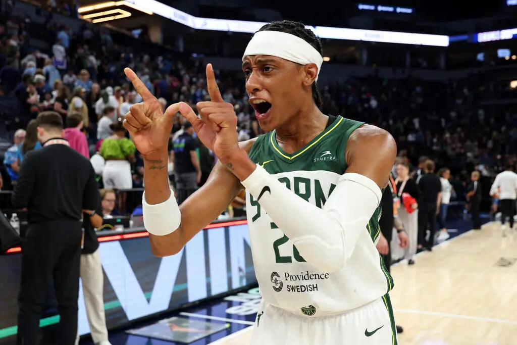 Seattle Storm guard Brittney Sykes forms the letter W with her hands to celebrate a 2025 WNBA win.