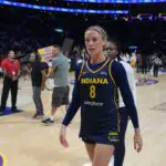 Indiana Fever guard Sophie Cunningham walks off the court after a 2025 WNBA game.