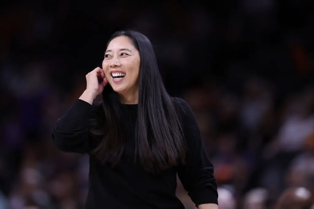 Natalie Nakase, head coach smiles towards her team during the second quarter against the Phoenix Mercury at PHX Arena on May 11, 2025 in Phoenix, Arizona.