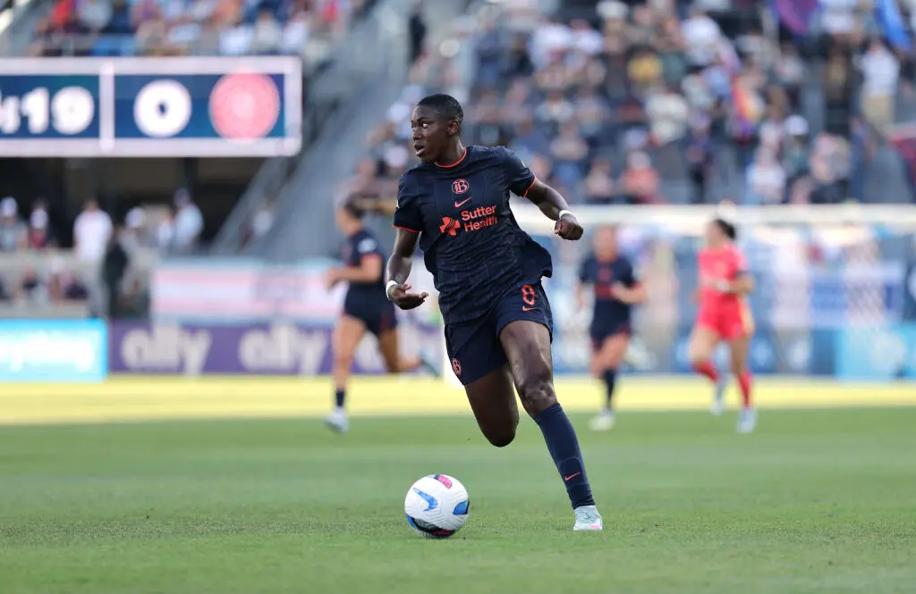 Bay FC forward Asisat Oshoala dribbles the ball down the pitch during a 2025 NWSL match.