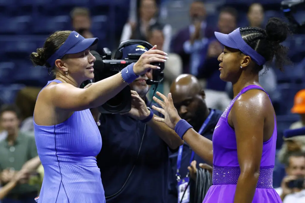 US tennis star Amanda Anisimova greets Japan's Naomi Osaka at the net after winning the pair's 2025 US Open semifinal.