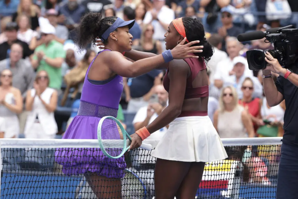 Naomi Osaka hugs Coco Gauff after her Round-of-16 upset win over Gauff at the 2025 US Open.