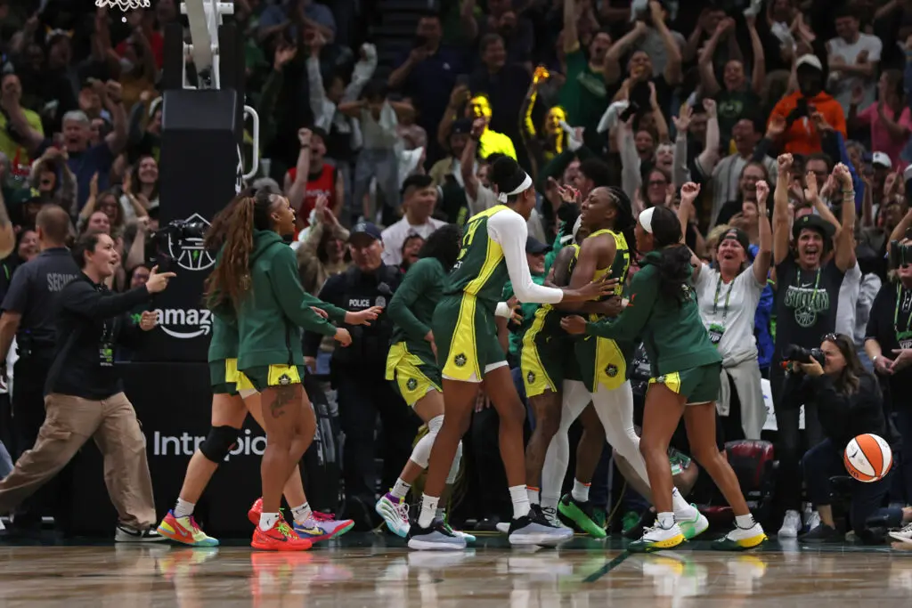 The Seattle Storm celebrate the win that clinched their spot in the 2025 WNBA Playoffs.