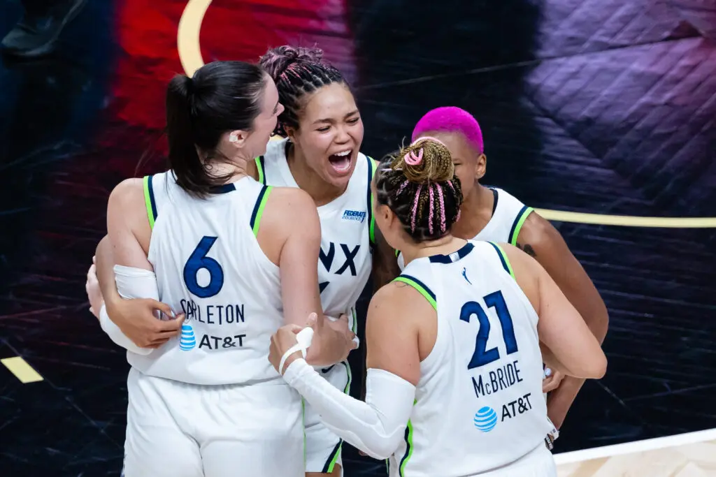 Minnesota Lynx teammates Napheesa Collier, Courtney Williams, Kayla McBride, and Bridget Carleton celebrate their first-round sweep in the 2025 WNBA Playoffs.