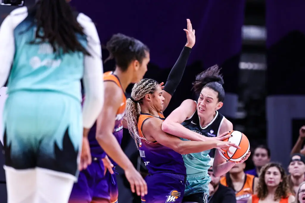 Phoenix Mercury forward Satou Sabally tries to block a pass from New York Liberty star Breanna Stewart during Game 1 of the 2025 WNBA Playoffs.