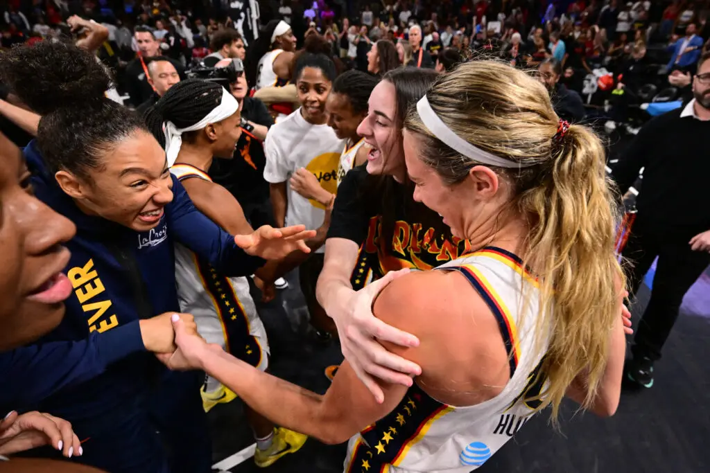 The Indiana Fever celebrate the win that booked them a spot in the 2025 WNBA semifinals.