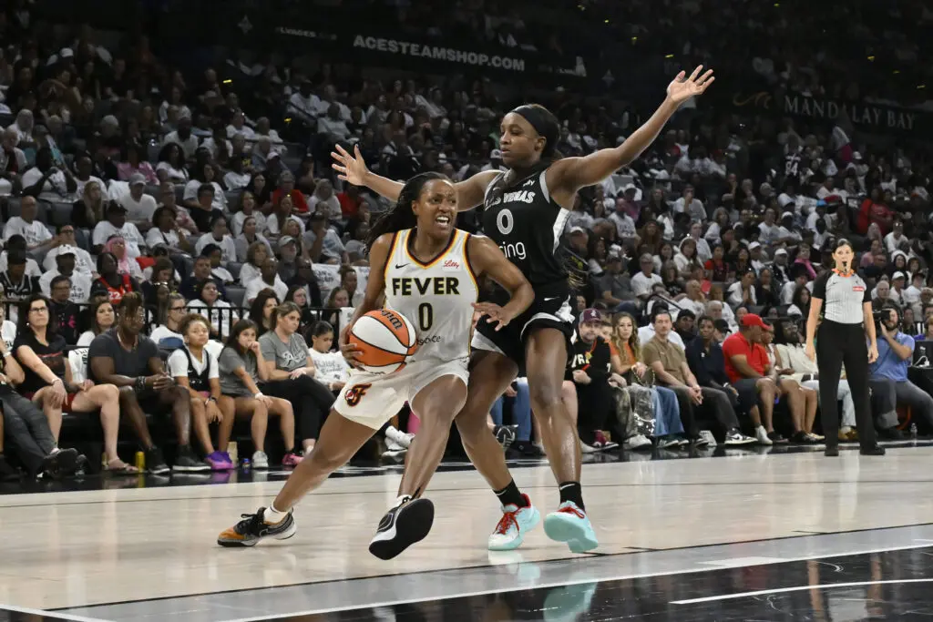 Las Vegas Aces guard Jackie Young defends Indiana Fever guard Kelsey Mitchell during Game 1 of the 2025 WNBA semifinals.