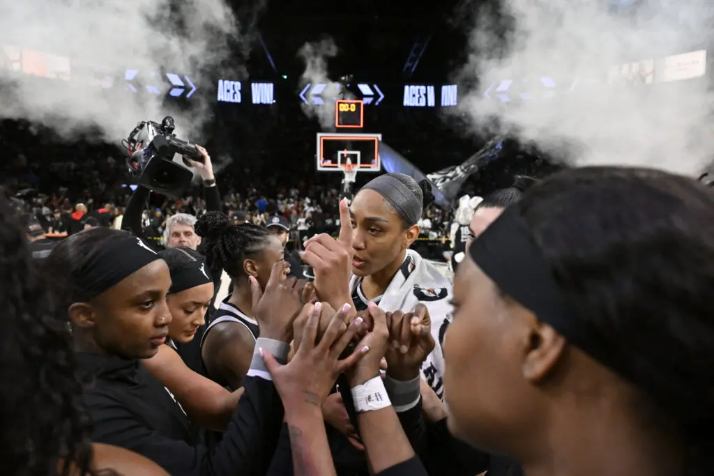 The Las Vegas Aces huddle after their Game 2 win in the 2025 WNBA semifinals.