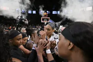 The Las Vegas Aces huddle after their Game 2 win in the 2025 WNBA semifinals.