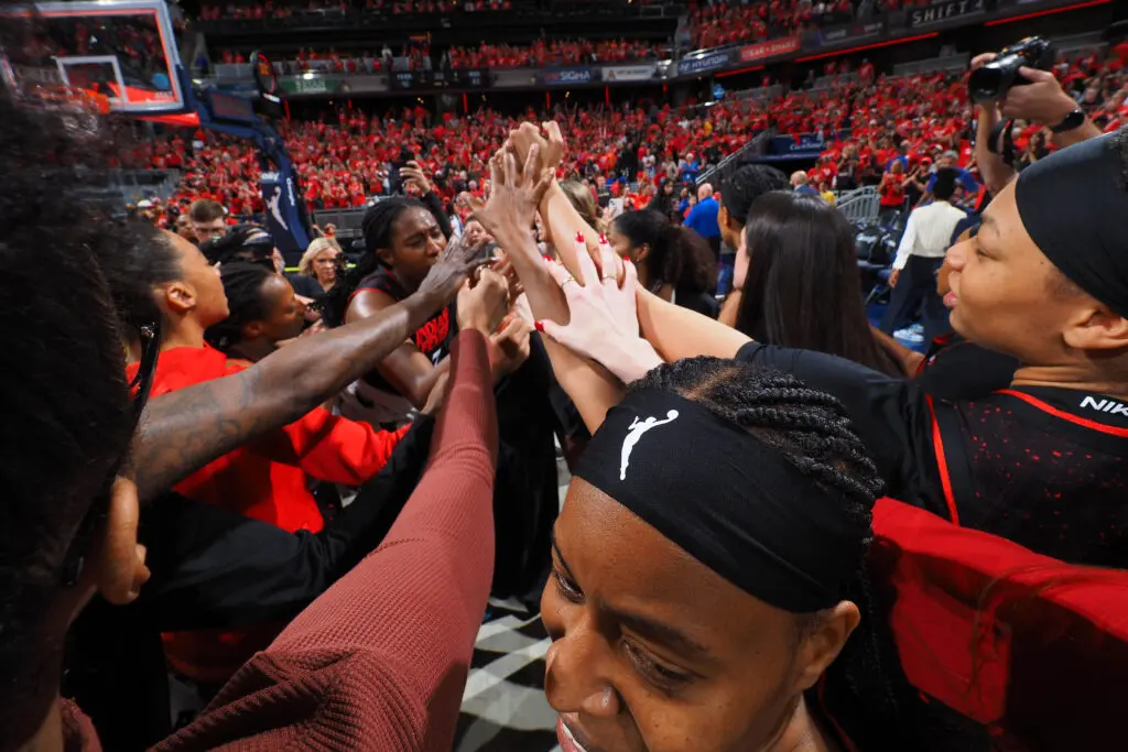 The Indiana Fever huddle after defeating the Las Vegas Aces in Game 4 of the 2025 WNBA semifinals.