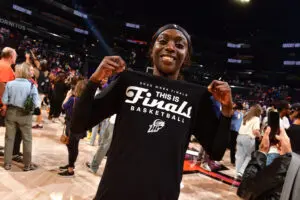 Phoenix Mercury star Kahleah Copper proudly poses in her "This is Finals basketball" T-shirt following her team's series win in the 2025 WNBA semifinals.