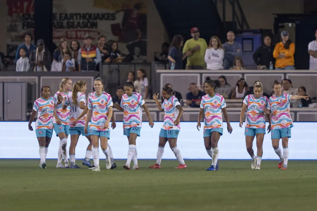 The San Diego Wave walk across the pitch during a 2025 NWSL match.