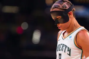 New York Liberty guard Natasha Cloud looks down during a 2025 WNBA game.