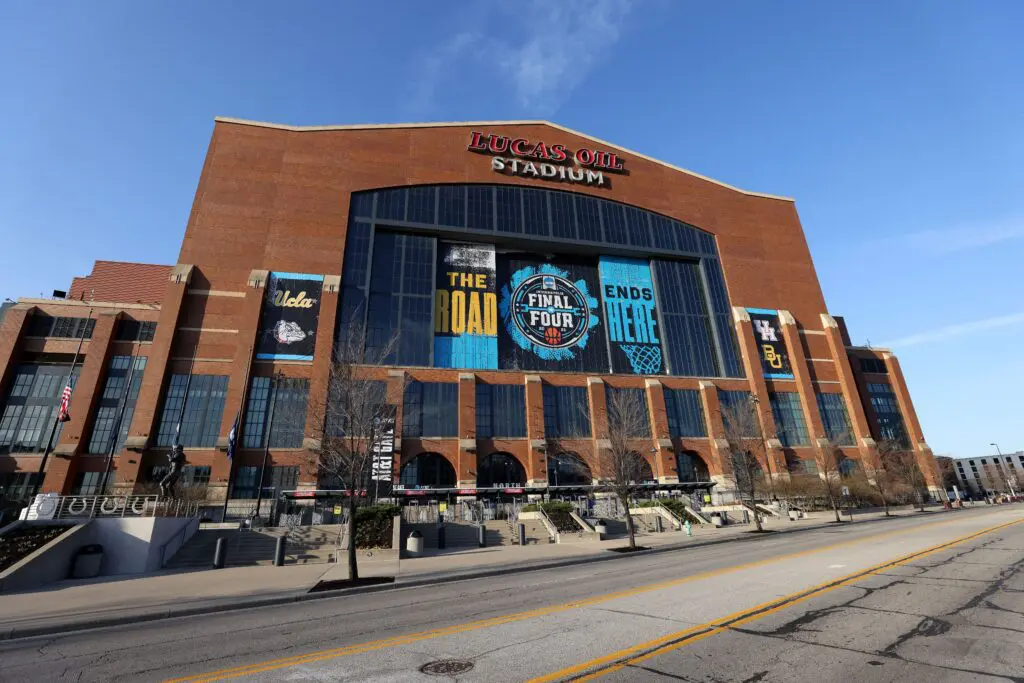An exterior view of Indianapolis's Lucas Oil Stadium with signage for the 2021 NCAA Men's Basketball Final Four.