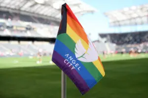 A Pride celebration Angel City corner flag awaits a 2023 NWSL match.