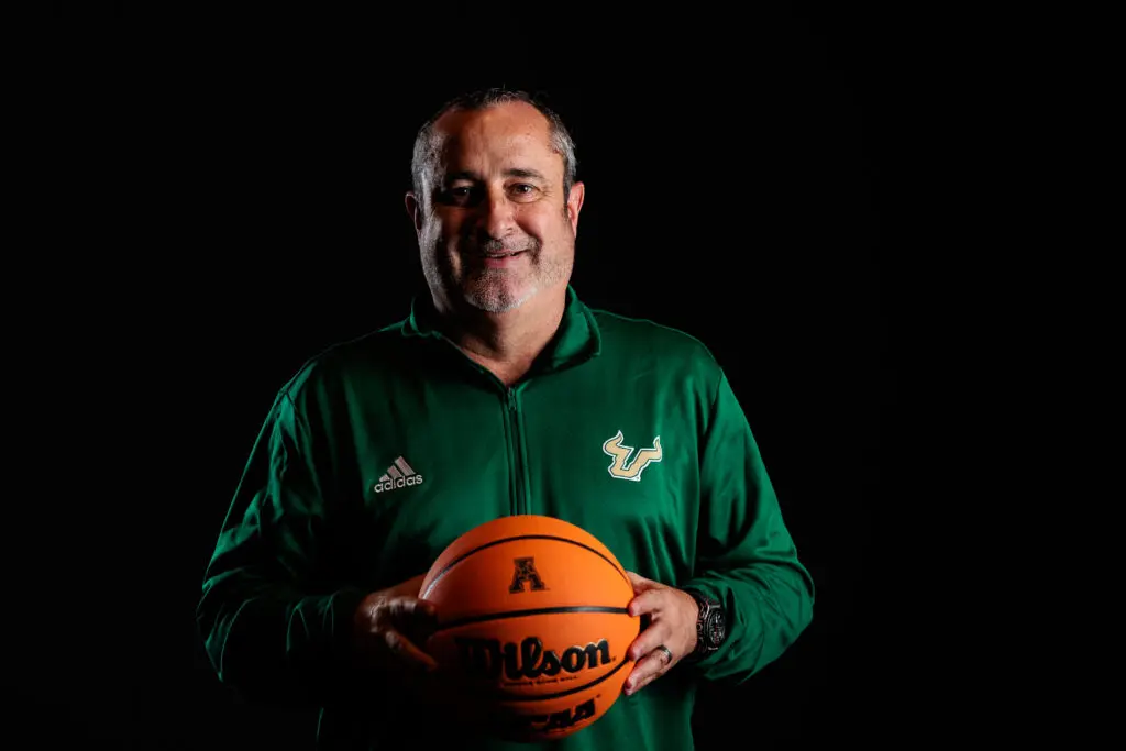 USF women's basketball head coach Jose Fernandez poses for a photo at the 2024 AAC Media Day.