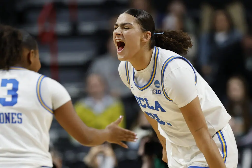 UCLA center Lauren Betts yells in triumph after the Bruins' 2025 Elite Eight victory.