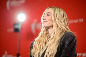 UConn basketball star Paige Bueckers smiles on the orange carpet at the 2025 WNBA Draft.