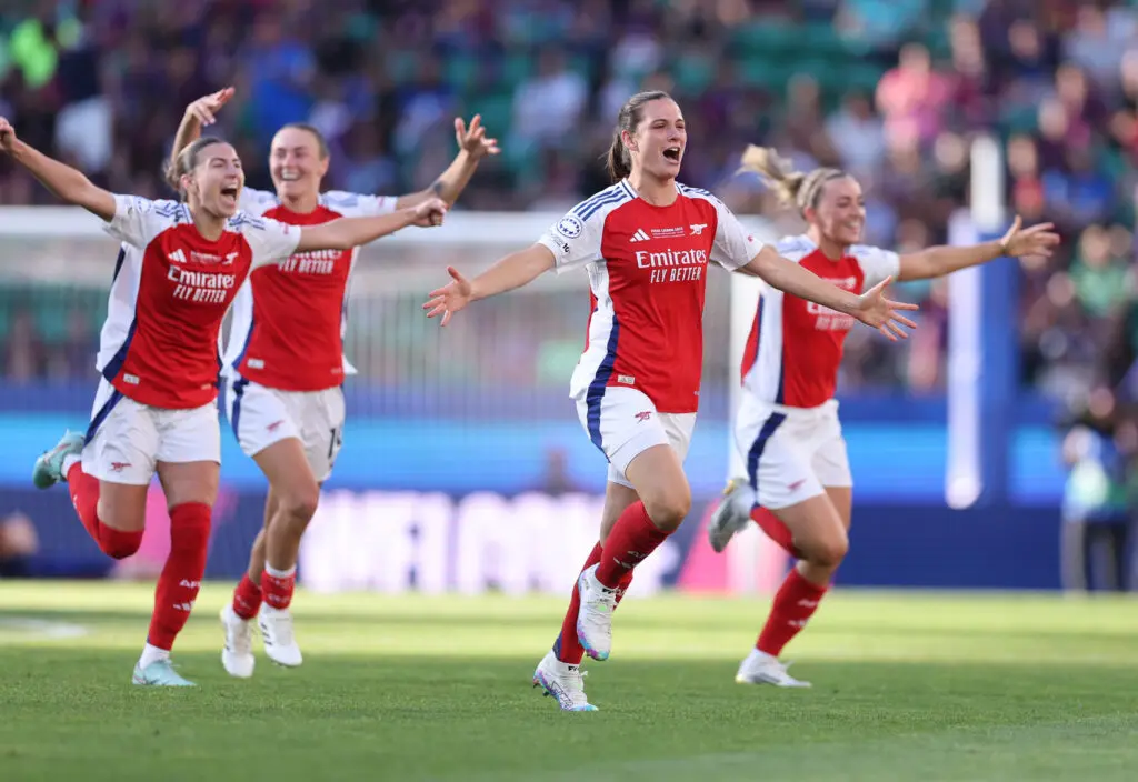 Center back Laia Codina and her Arsenal teammates run across the pitch in celebration after winning the 2024/25 UEFA Champions League title.