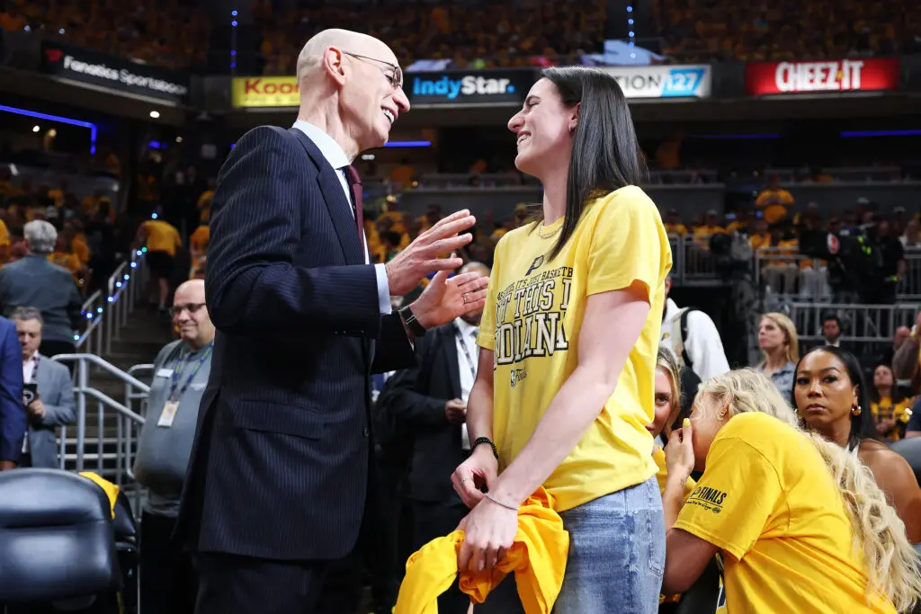 NBA commissioner Adam Silver chats with Indiana Fever guard Caitlin Clark during Game 3 of the 2025 NBA Finals.