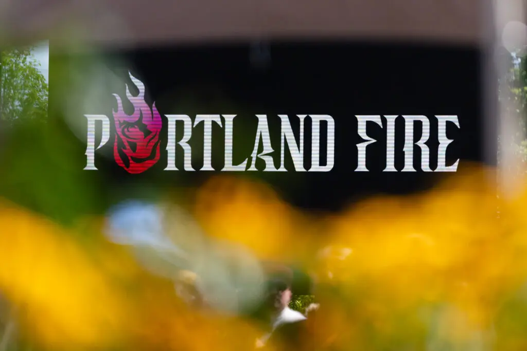 The new logo for incoming WNBA expansion team Portland Fire is revealed during a July 2025 launch party.