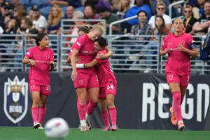 North Carolina Courage midfielder Manaka Matsukubo hugs forward Hannah Betfort after Betfort's goal during a 2025 NWSL match.