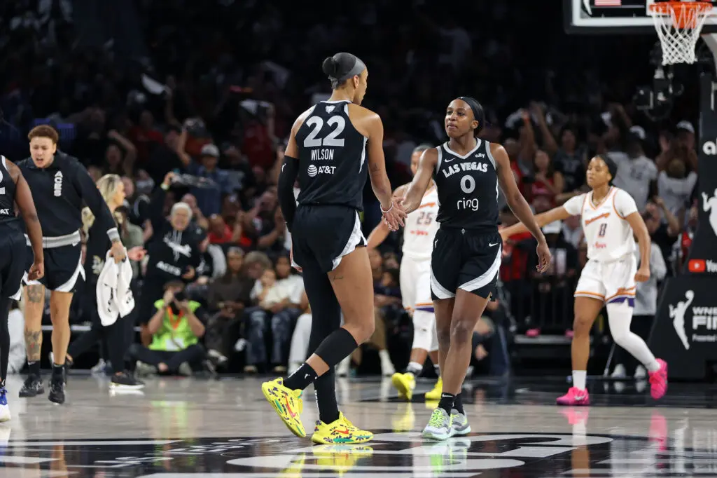 Las Vegas Aces center A'ja Wilson high-fives guard Jackie Young during Game 2 of the 2025 WNBA Finals.