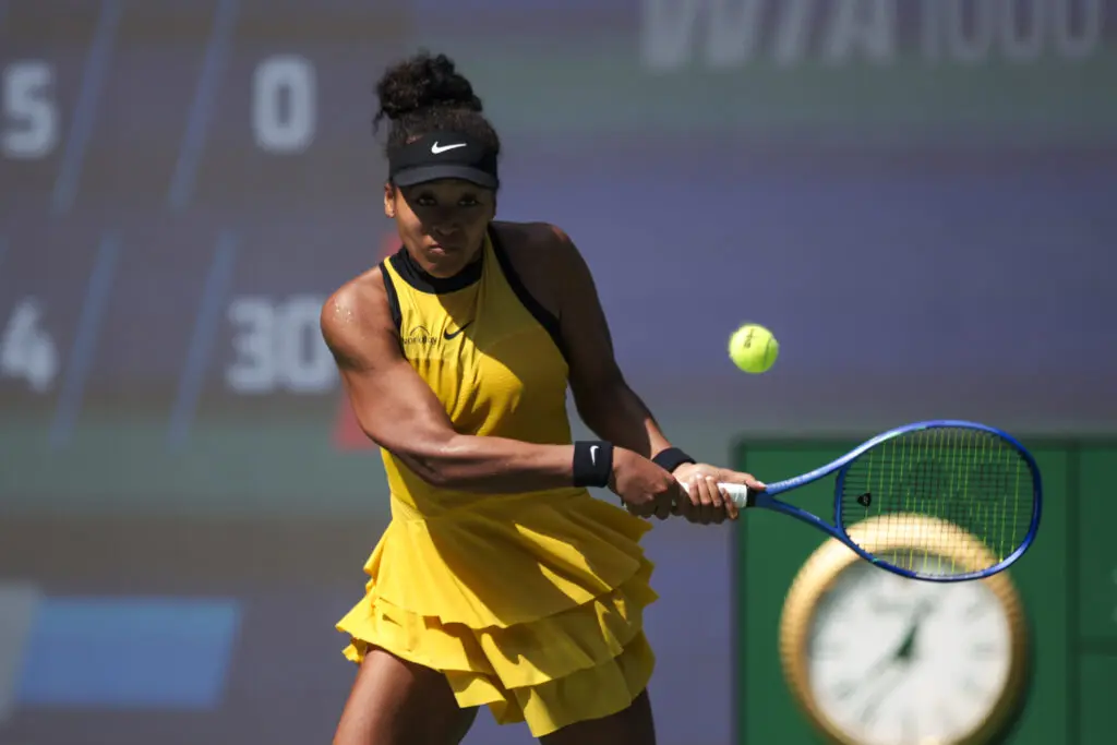 Japanese tennis star Naomi Osaka preps a return during her Round of 64 match at the 2025 Wuhan Open.