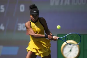 Japanese tennis star Naomi Osaka preps a return during her Round of 64 match at the 2025 Wuhan Open.