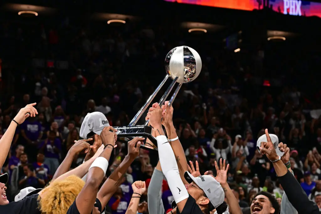The Las Vegas Aces hoist the 2025 WNBA Championship trophy.