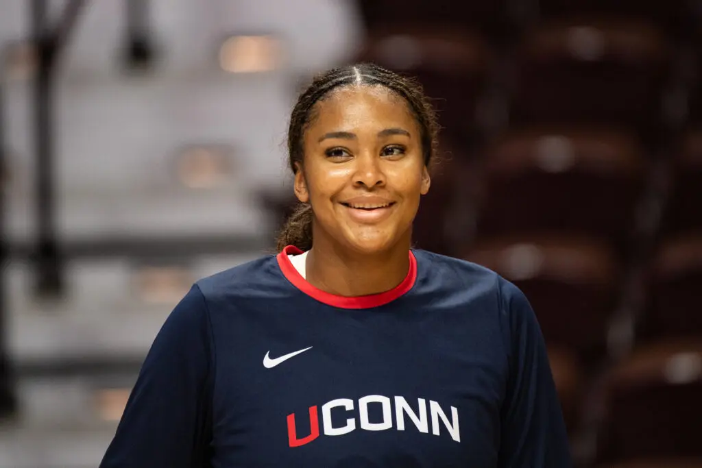 UConn star sophomore Sarah Strong smiles during warm-ups before a 2025 preseason exhibition game.