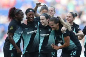 Gotham midfielder Rose Lavelle celebrates a goal with her teammates during a 2025 NWSL match.