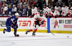 USA hockey star Hilary Knight chases Canada forward Emily Clark across the ice during the 2024 IIHF Women's World Championship final.