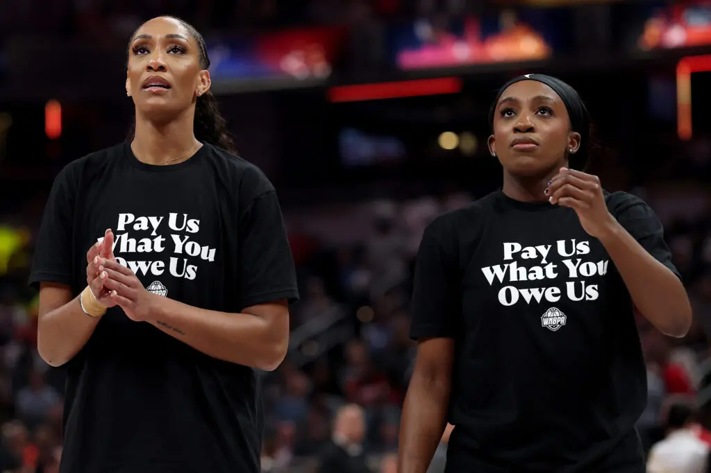 Las Vegas Aces stars A'ja Wilson and Jackie Young wear T-shirts saying "Pay Us What You Owe Us" prior to the 2025 WNBA All-Star Game.