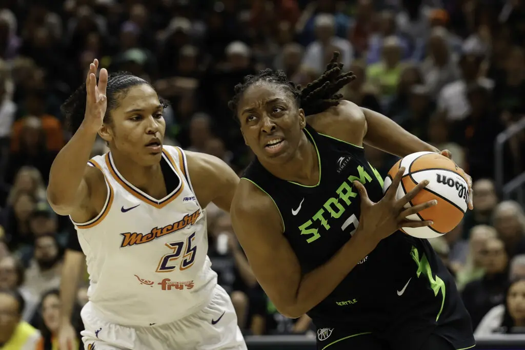 Phoenix Mercury forward Alyssa Thomas defends as Seattle Storm star Nneka Ogwumike drives to the basket during a 2025 WNBA game.
