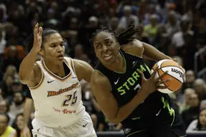Phoenix Mercury forward Alyssa Thomas defends as Seattle Storm star Nneka Ogwumike drives to the basket during a 2025 WNBA game.