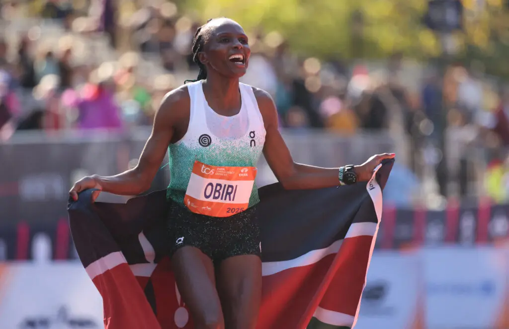 Kenyan runner Hellen Obiri celebrates winning the 2025 New York Marathon.