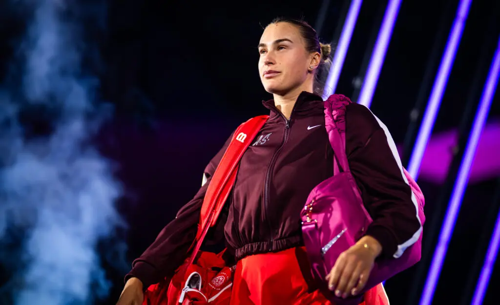 World No. 1 Aryna Sabalenka enters the court for a 2025 WTA Finals match.