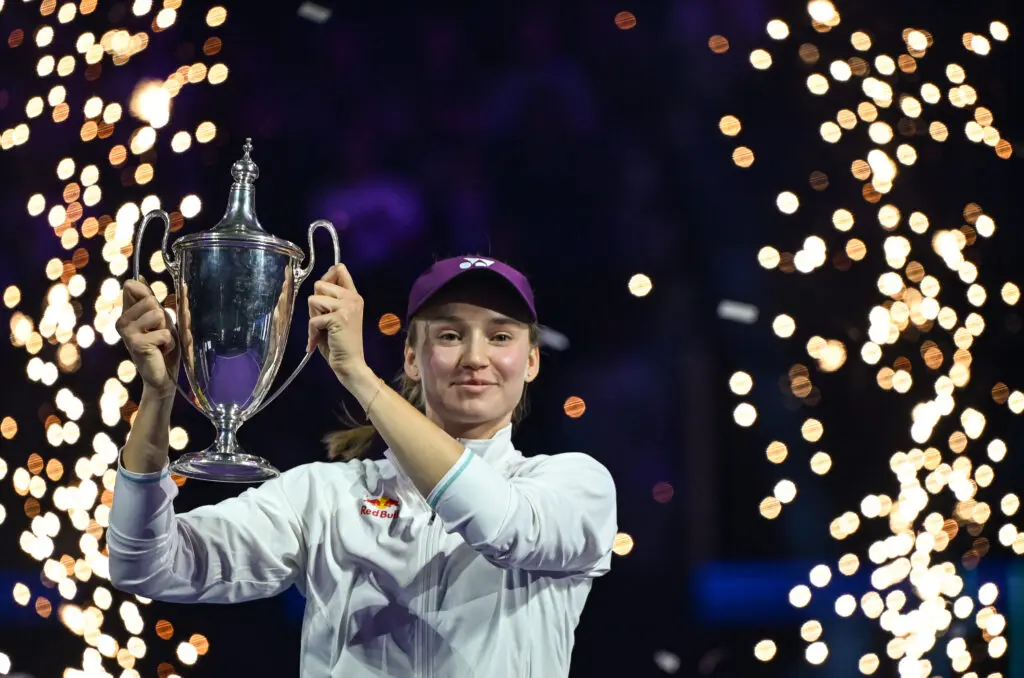Kazakhstan tennis star Elena Rybakina lifts the Billie Jean King Trophy after winning the 2025 WTA Finals.